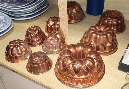 A collection of nine copper jelly moulds